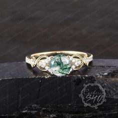 Vintage moss agate engagement ring Art deco solid 14k gold promise ring Unique green gemstone twist ring Handmade jewelry gifts for women Engagement ring Center Stone: Moss agate Cut: Round cut Size: 6mm Side stone: Moissanite Color: D-F  Clarity: VVS1 Weight: 0.212ctw Or Natural Diamond Color: G-H  Clarity: SI-VS Weight: 0.212ctw Width: 1.6mm Thickness: 1.2mm Wedding band Stone: Moissanite + Moss agate Weight: 0.195ctw Or Natural Diamond + Moss agate Weight: 0.195ctw Width:1.5mm Thickness: 1.3m Green Moissanite Jewelry For Promise Ring, Green Promise Ring Jewelry With Round Stone, Solitaire Moissanite Jewelry For May Birthstone, May Birthstone Moissanite Solitaire Jewelry, Round Emerald Jewelry For Promise, Elegant Jewelry With Round Cut May Birthstone, Fine Jewelry With May Birthstone Center Stone, Unique Round Stone Jewelry For Anniversary, Green Moissanite Ring Jewelry