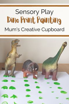 three dinosaurs are on top of a white sheet with green paint and the words, sensory play dino print painting mum's creative cupboard