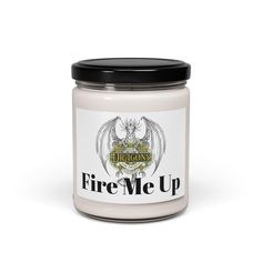 a jar of fire me up candle on a white background with the words dragon's logo