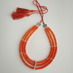 < Orange coral necklace > This product made according to the model of authentic traditional Ukrainian jewelry. The coral is modern, the design is vintage. Like 99% of the coral on the market these days, this coral has been dyed. I use bamboo coral which is not endangered or threatened in any way, unlike natural pink or red coral (the production of which is forbidden almost everywhere in the world). Bamboo coral doesn't mean it's not organic. Every bead of it has a distinctive and beautiful Orange Red Coral Beads For Jewelry Making, Orange Red Coral Necklace With Round Beads, Orange Gemstone Beads Necklace In Red Coral, Orange Red Coral Gemstone Beaded Necklaces, Orange Red Coral Gemstone Beaded Necklace, Orange Red Coral Beaded Necklaces Hand-strung, Spiritual Orange Necklace Made Of Red Coral, Spiritual Orange Red Coral Necklace, Orange Red Coral Necklace With Colorful Beads