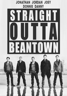 a group of men standing next to each other in front of a sign that says straight outa beantown