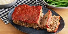 meatloaf on a plate with green beans and rice