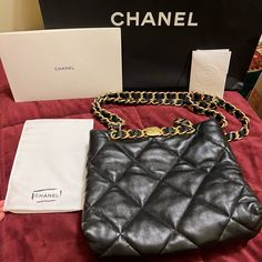 Gorgeous Chanel Small Shopping Bag In Black Lambskin With Gold Hardware. Very Lightly Used- Inside Is Pristine, With Original Plastic Wrap Still On Some Hardware. Minor Scuffs To The Outside Hardware From Normal Wear And Tear. Leather Is In Perfect Condition- No Visible Signs Of Use On Leather. Worn A Handful Of Times By My Mom But She Has Other Purses She Uses More. I Cross Post On Other Platforms Too, Sometimes For Less- Find Me There. High-end Pouch Shoulder Bag With Branded Hardware, High-end Black Pouch Bag, High-end Soft Leather Shoulder Bag For Shopping, Luxury Shoulder Bag With Branded Hardware, High-end Evening Bag With Removable Pouch, Designer Soft Leather Pouch Shoulder Bag, High-end Black Shoulder Evening Bag, Designer Soft Leather Shoulder Bag For Everyday Luxury, Luxury Black Crossbody Evening Bag