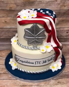 a cake decorated with an american flag and flowers