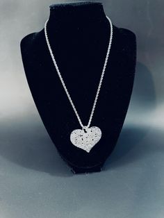 Sterling silver 3 D filigree puffy heart with a 24" twirled rope chain. The heart is a combination of leaves, flowers and vines. This  perfect gift will be carefully packed and promptly shipped with insurance. Send measage if you would like it  gift wrapped or message included. Heart-shaped Silver Chain Jewelry For Anniversary, Silver Heart Jewelry With Large Pendant, Elegant Metal Heart Necklace With Silver Chain, Valentine's Day Heart Pendant Jewelry With Silver Chain, Valentine's Day Heart Pendant Silver Chain Jewelry, Valentine's Day Heart Pendant With Silver Chain, Silver Jewelry With Large Pendant For Valentine's Day, Valentine's Day Silver Jewelry With Large Pendant, Silver Filigree Heart Pendant Necklace