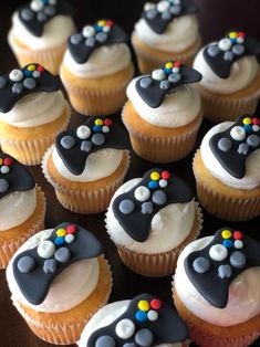 cupcakes with black and white frosting decorated like video game controllers