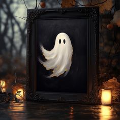 a painting of a ghost in a frame on a table with candles and pumpkins