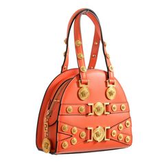 Versace Tribute 100% Leather Orange Women's Handbag Shoulder Bag Country/Region Of Manufacture: Italy Retail Value: $1950.00 This Is Authentic Versace Tribute 100% Leather Orange Women's Handbag Shoulder Bag Material: 100% Leather Sku: V-14433 Height: 6.5" Width: 2" Length: 7.25" Strap Drop: 6"-20" Luxury Orange Crossbody Satchel, Luxury Handheld Orange Bag, Luxury Orange Handheld Bag, Luxury Orange Shoulder Bag With Double Handle, Luxury Handheld Bags With Metal Hardware, Luxury Orange Satchel With Detachable Strap, Luxury Orange Top Handle Satchel, Designer Orange Top Handle Satchel, Luxury Orange Bag With Gold-tone Hardware