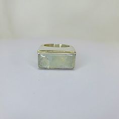 "Moonstone Sterling silver handmade ring. Statement Moonstone of AAA quality, the stone is set up in rectangular East-West orientation. The style of this sterling silver gem would be likened to a signet ring. Great for a mens engagement and simply a stunning pinky ring, A stone for \"new beginnings\", Moonstone is a stone of inner growth and strength. It soothes emotional instability and stress, and stabilizes the emotions, providing calmness. Moonstone enhances intuition, promotes inspiration, Modern White Opal Ring, Minimalist Silver Rings With Rectangular Stone, Modern White Opal Gemstone Ring, Modern Moonstone Ring With Large Stone For Gift, Modern Moonstone Ring With Large Stone As Gift, Modern Silver Opal Ring With Gemstone, Modern Moonstone Ring With Large Stone, Modern White Moonstone Ring, Modern White Moonstone Ring In Sterling Silver