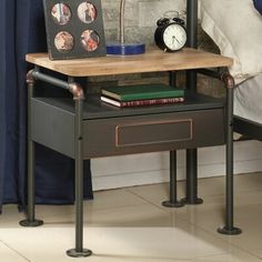 an end table with a clock and some books on it