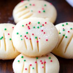 some cookies with sprinkles are on a table