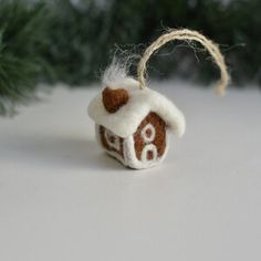 a brown and white ornament hanging from a tree