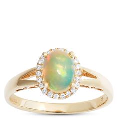 an opal and diamond ring in yellow gold