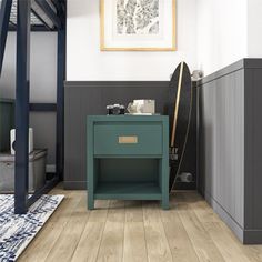 a living room with wood floors and gray walls