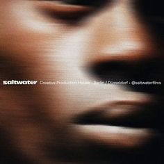 a blurry image of a man's face with the words saltwater on it