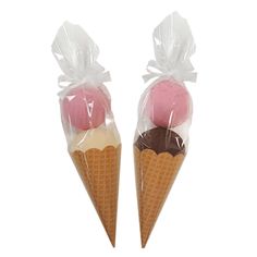 two ice cream cones wrapped in plastic bags