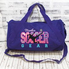 This personalized Soccer bag has pink purple applique and turquoise accents. Perfect to to hold all your gear whether for after school practice, competitions or even a weekend at grandma's! Take a tote bag to the field, or a duffle bag for a girls weekend. Add a name for a super personalized on the go bag. With a design you won’t find anywhere else, Persunly duffle bags show off your favorite activity, while keeping all your gear handy and protected. Our three sizes are roomy and fit shoes, clot Pink Duffle Bag With Zipper Closure For Daily Use, Purple Duffle Bag For Daily Use, Pink Duffle Bag With Zipper Closure For Sports, Pink Duffle Bag With Removable Pouch For On-the-go, Soccer Bag, Small Luggage, Travel Duffle Bag With Large Capacity, Multicolor, Go Bags, Zipper Tote Bag