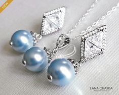 Wedding Light Blue Blush Baby Blue Colored Pearl Silver Earrings and Necklace Bridal Jewelry Set with .925 Sterling Silver Chain. CHAIN is 18 inches (45.7cm) long. EARRINGS are about 1.18 inch (3cm) long from top of earring stud to bottom. PENDANT is about 0.90 inch (2.3cm) long including bail. BRIDAL BRACELET SECTION: https://www.etsy.com/shop/LanaChayka?ref=seller-platform-mcnav§ion_id=11638942 BRIDAL EARRINGS SECTION: https://www.etsy.com/shop/LanaChayka?ref=seller-platform-mcnav§ion_id=11638940 BRIDAL JEWELRY SETS SECTION: https://www.etsy.com/shop/LanaChayka?ref=seller-platform-mcnav§ion_id=25839214 BRIDAL NECKLACES SECTION: https://www.etsy.com/shop/LanaChayka?ref=seller-platform-mcnav§ion_id=11638944 Elegant and classy, this stunning jewelry set is perfect for weddings or special oc Blue Teardrop Jewelry For Wedding, Blue Teardrop Wedding Jewelry, Sapphire Jewelry Sets For Wedding, Blue Pearl Drop Jewelry For Gift, Blue Wedding Jewelry With Matching Earrings, Blue Round Bridal Earrings For Formal Occasions, Blue Teardrop Jewelry Sets For Formal Occasions, Blue Round Jewelry Sets For Wedding, Light Blue Sterling Silver Earrings For Wedding