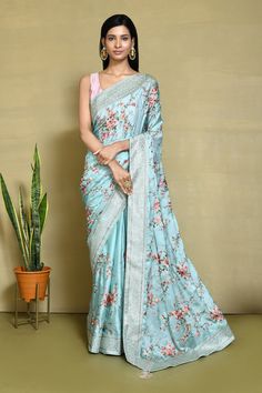 Ice blue silk embroidered saree with blouse N7476D Get your hands on the newest collection of exquisite satin silk sarees adorned with intricate embroidery and stunning stone embellishments, all at budget-friendly prices. These sarees feature soft pastel tones and elegant floral designs, ensuring they remain stylish and timeless for years to come. Purchase these luxurious satin silk sarees exclusively at Kollybollyethnics. Desc:  Color : Ice Blue Fabric : satin silk Blouse Work : embroidery with woven designmer border  Wash Care : Dry clean Sleeve Style : Half Sleeve Long Sleeves : Done only in Custom Stitch Sleeves Lining : Done only in Custom Stitch Bust Size : 32 to 42 Inches Occasion : Festival   Christmas   Eid   Ceremonial   Pongal   Lohri   Gudi Padwa   Onam   Ugadi   VaisakhiF Luxury Blue Blouse With Floral Embroidery, Diwali Floral Embroidered Silk Pre-draped Saree, Festive Pre-draped Saree With Floral Embroidery In Art Silk, Anarkali Silk Saree With Floral Embroidery, Silk Anarkali Pre-draped Saree With Floral Embroidery, Anarkali Pre-draped Silk Saree With Floral Embroidery, Silk Saree With Floral Embroidery, Blue Floral Embroidered Pre-draped Saree For Wedding, Festive Art Silk Saree With Floral Embroidery