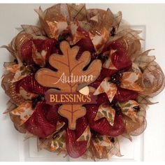 a fall wreath with the words autumn blessing on it