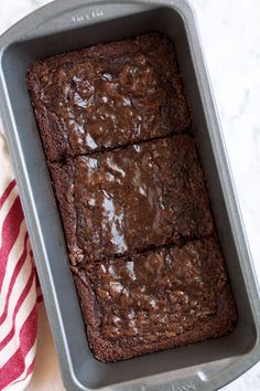 chocolate brownies in a baking pan on a table