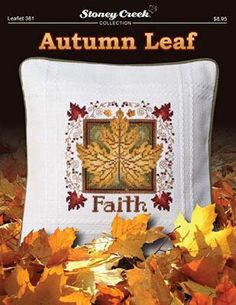 an autumn leaf cross stitch pattern on a white pillow with yellow leaves around it and the words, autumn leaf faith