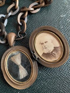 A beautiful Victorian Vulcanite Photo Locket and Chain With Lock Of Hair and Gold Filled Components.  I have no information on the portrait of the man in the locket.  What I do know is that it was taken by the photographer Louis Werner at his studio at 15 Leinster Street Dublin sometime between 1864 to 1885.  By looking a little closer at the symbolic meaning of the intricately decorated Stag and Oak tree depiction on the locket, one may presume that the gentleman in the photograph may have been Victorian Hair Locket, Hair Locket, Victorian Portraits, Der Gentleman, Victorian Hairstyles, Hair Locks, Photo Locket, Oak Tree, Memento Mori