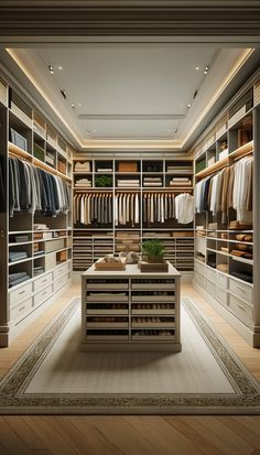 a large walk in closet with lots of clothes