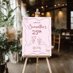 an easel with a sign that says welcome to someone's 25th birthday