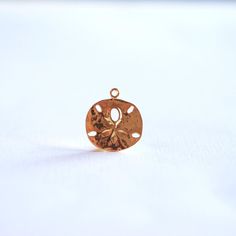 Shiny Vermeil Gold Sand Dollar- 18k gold over Sterling Silver Sand dollar charm, Gold starfish charm Gold Jewelry With Flower Charm For Beach, Gold Beach Jewelry With Flower Charm, Gold Pendant Jewelry With Starfish Charm, Gold Flower Charm Pendant, Gold Pendant Flower Charm, Gold Pendant Charm With Flower Detail, Gold Sand, Sand Dollar, Black Rhodium