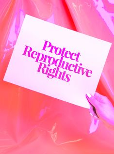 a person holding up a sign that says project reproductive rights