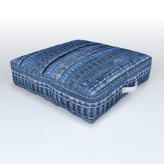 an image of a blue cushion that looks like it is made out of denim fabric