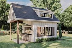 a small house with a covered porch and an attached kitchen area in the front yard