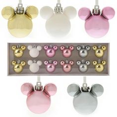 the mickey mouse ornament collection is shown in four different colors and sizes, including pink, white, blue, yellow, and silver