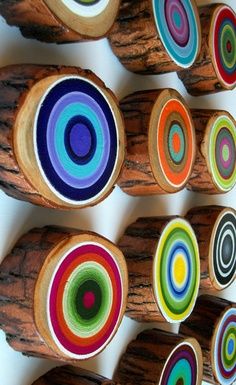 several pieces of wood with different colored circles on them