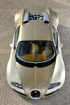 an overhead view of a beige sports car