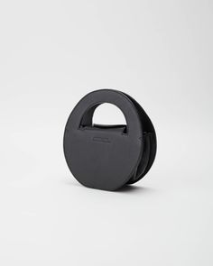 Circle Bag from Anissa Aida in Black Black Top Handle Box Bag With Dust Bag, Luxury Black Evening Bag With Detachable Handle, Black Evening Bag With Detachable Strap For Shopping, Black Top Handle Evening Bag For Travel, Black Luxury Top Handle Evening Bag, Black Luxury Evening Bag With Top Handle, Black Top Handle Box Bag With Detachable Strap, Black Top Handle Box Bag With Detachable Handle, Designer Black Evening Bag For Everyday Use