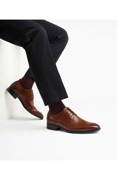 Classic and versatile, this plain-toe leather derby features simple detailing that smartly grounds any formal or semiformal look. Lace-up style Leather upper/synthetic lining and sole Imported Timeless Business Casual Derby Shoes, Timeless Plain Toe Lace-up Shoes For Business Casual, Business Lace-up Shoes With Goodyear Welt And Plain Toe, Timeless Plain Toe Lace-up Shoes For Derby, Timeless Plain Toe Lace-up Derby Shoes, Semi-formal Plain Toe Loafers, Oxford Lace-up Shoes With Leather Lining For Business, Oxford Plain Toe Loafers For Derby, Timeless Plain Toe Oxfords For Business