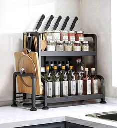 a kitchen counter with a cutting board and knifes on it