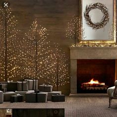 a living room filled with furniture and a fire place in front of a christmas tree