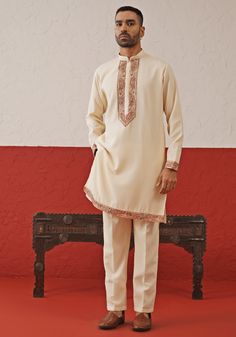 Elevate your ethnic charm with a stunning Cream Kurta. Crafted from georgette, the kurta features resham, zari, and sequinned embroidery, along with intricate detailing on the daman and cuffs. Paired with a matching pants, this ensemble radiates sophistication and elegance. Perfect for special occasions like Sangeet, Mehendi, Haldi, or as a wedding guest outfit. Composition : Kurta & Trouser : Viscose Georgette Care: Dry Clean Only and Vacuum Storage This product can be customized for sleeves, length and colour Delivery : 4-6 weeks as the product is hand crafted. Check Size Guide or choose MySize for free customisation (All Sizes above XL can be made at 15% additional cost) For more information and sizes please contact fabiliciousfashion@gmail.com or visit our Copenhagen studio. About the Semi-stitched Traditional Georgette Sherwani, Traditional Semi-stitched Georgette Sherwani, Bollywood Sherwani With Intricate Embroidery In Georgette, Bollywood Style Semi-stitched Georgette Sherwani, Festive Sherwani With Intricate Embroidery In Georgette, Festive Georgette Sherwani With Intricate Embroidery, Festive Semi-stitched Georgette Sherwani, Festive Chinon Sherwani With Intricate Embroidery, Semi-stitched Georgette Sherwani With Traditional Drape