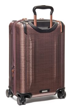 This suitcase is designed to be extra lightweight and expands to allow you to pack more while still enjoying the rigid structure and durability of a hard case.Closure: The two-way zip-around Omega Closure System® features a low-profile integrated TSA-approved lock with three-digit combination dials for extra security.Exterior features: Protective bumpers accent the streamlined silhouette while adding to the built-to-last nature of the case. It has a built-in USB-C port to keep you connected on t Modern Hard Shell Luggage With Sleeve, Luxury Luggage With Rectangular Case And Sleeve, Luxury Rectangular Luggage With Sleeve, Rectangular Hard Shell Luggage For Business Trips, Rectangular Hard Shell Travel Case, Hard Shell Case With Luggage Sleeve, Elegant Rectangular Luggage With Top Carry Handle, Modern Hard Shell Rectangular Case, Modern Rectangular Hard Shell Case