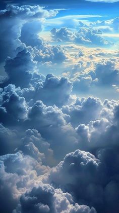 the sky is filled with clouds and bright blue light coming from behind it, as seen from an airplane window