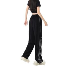 Stay comfortable and stylish when out and about in these premium Women's Street Mask Embroidered Sweatpants. Crafted with a drawstring waist and two side pockets, these soft and lightweight sweatpants offer superior comfort and convenience. An embroidered Street Mask detail gives the design a unique finish. Features: -100% Polyester -Mid-rise Waist -Drawstring Waistband -Letter Embroidery -Mask Graphic -Solid color -Straight Leg -Regular Fit Casual High-waisted Sweatpants For Streetwear, Streetwear High-waisted Sweatpants With Elastic Waistband, Black Drawstring Pants For Jogging, Black Drawstring Jogging Pants, Black Straight Leg Sweatpants With Letter Print, Black Wide Leg Pants For Jogging, Black Straight Leisure Sweatpants, Black Leisure Sweatpants Straight Fit, Black Straight Leg Sweatpants For Leisure