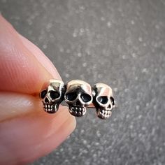 ♡ Be Inspired: Channel a bold and edgy vibe with the 3 Skulls Ear Cuff, expertly crafted from 925 Sterling Silver. This striking accessory features three intricately detailed skulls in a row, perfect for those who embrace gothic, biker, or punk-inspired style. Whether you're making a statement at a concert or adding a rebellious touch to your everyday look, this ear cuff is the ultimate piece to showcase your unique personality. ♡ Details: Material: 925 Sterling Silver Plating: Oxidized + E-coat Edgy Silver Skull Ring As Gift, Edgy Silver Skull Ring For Gift, Nickel-free Punk Piercings For Gift, Nickel-free Gothic Sterling Silver Piercings, Handmade Punk Cartilage Earrings, Handmade Punk Cartilage Earrings For Gifts, Silver Punk Style Ear Cuff Gift, Handmade Punk Cartilage Earrings As Gift, Silver Punk Style Ear Cuff For Gift