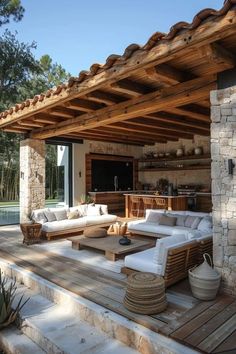 an outdoor living area with couches and tables