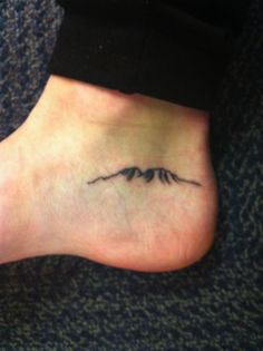 a small wave tattoo on the bottom of a person's foot is shown in this instagramtion