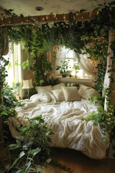 a bed covered in lots of green plants next to a window with lights on it