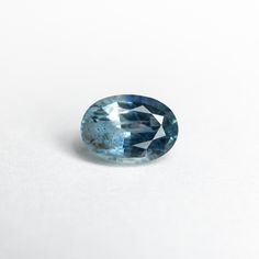 a blue diamond on a white surface