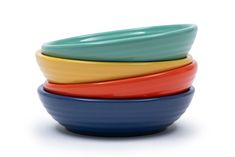 four colorful bowls stacked on top of each other